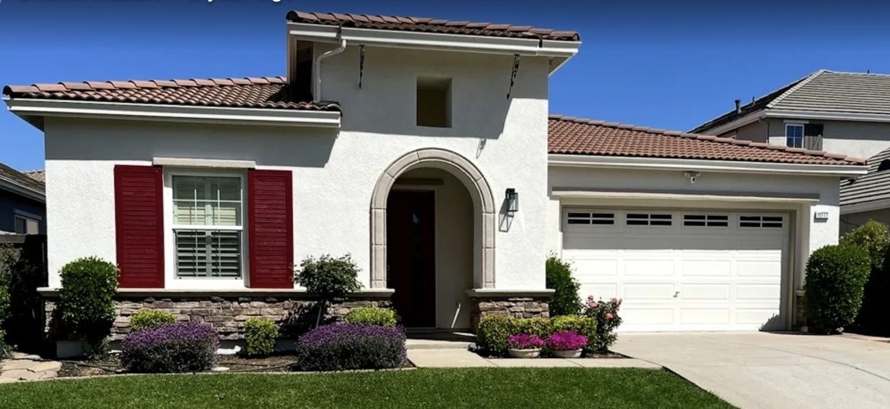 Two story stucco home with fresh exterior paint